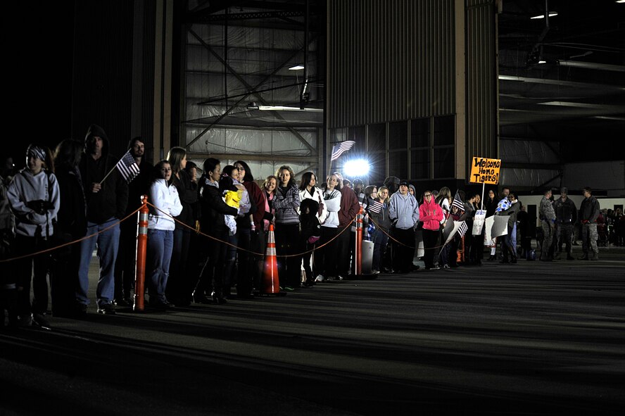 Friends and family wait for Airmen assigned to the 20th Fighter Wing to return from a deployment, Shaw Air Force Base, S.C., Feb. 7, 2014.  Approximately 200 Shaw Airmen were welcomed home after being deployed to U.S. Central Command’s Area of Responsibility. (U.S. Air Force photo by Airman 1st Class Jensen Stidham/Released)  