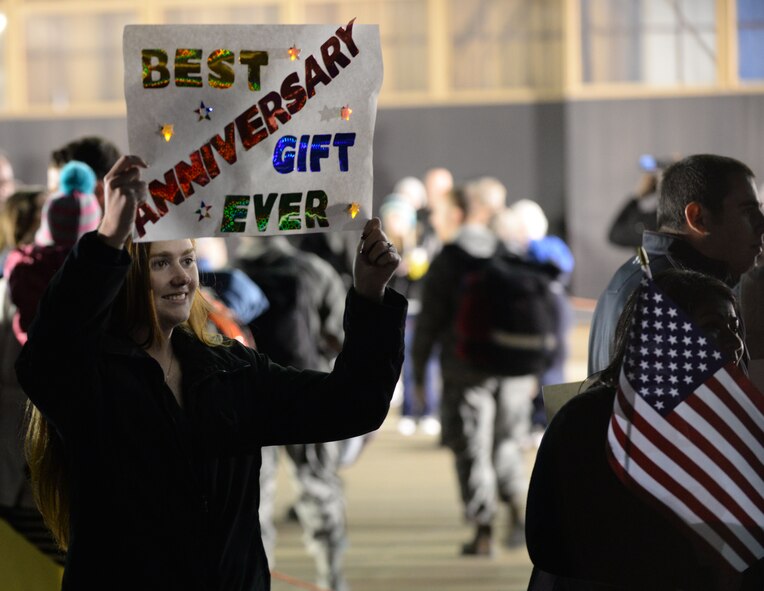 Rene Underwood awaits her husband, U.S. Air Force Senior Airman Rocky Underwood, 20th Aircraft Maintenance Squadron, Tigers Aircraft Maintenance unit weapons load crew member, who is returning home from deployment, Feb. 7, 2014. Rene and Rocky celebrated their Anniversary Tuesday. (U.S. Air Force photo by Airman 1st Class Michael A. Cossaboom/released)