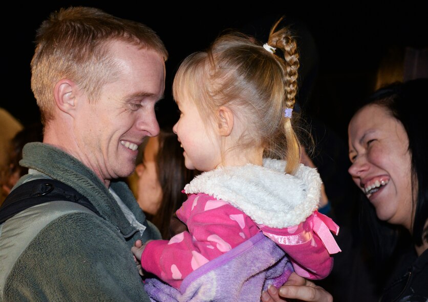 A Shaw Airmen greets his daughter after returning home to Shaw Air Force Base, S.C., from a five-month deployment to U.S. Central Command’s Area of Responsibility, Feb. 7, 2014. The Airmen were welcomed home by commanders, supervisors, family and friends. (U.S. Air Force photo by Airman 1st Class Jonathan Bass/Released)