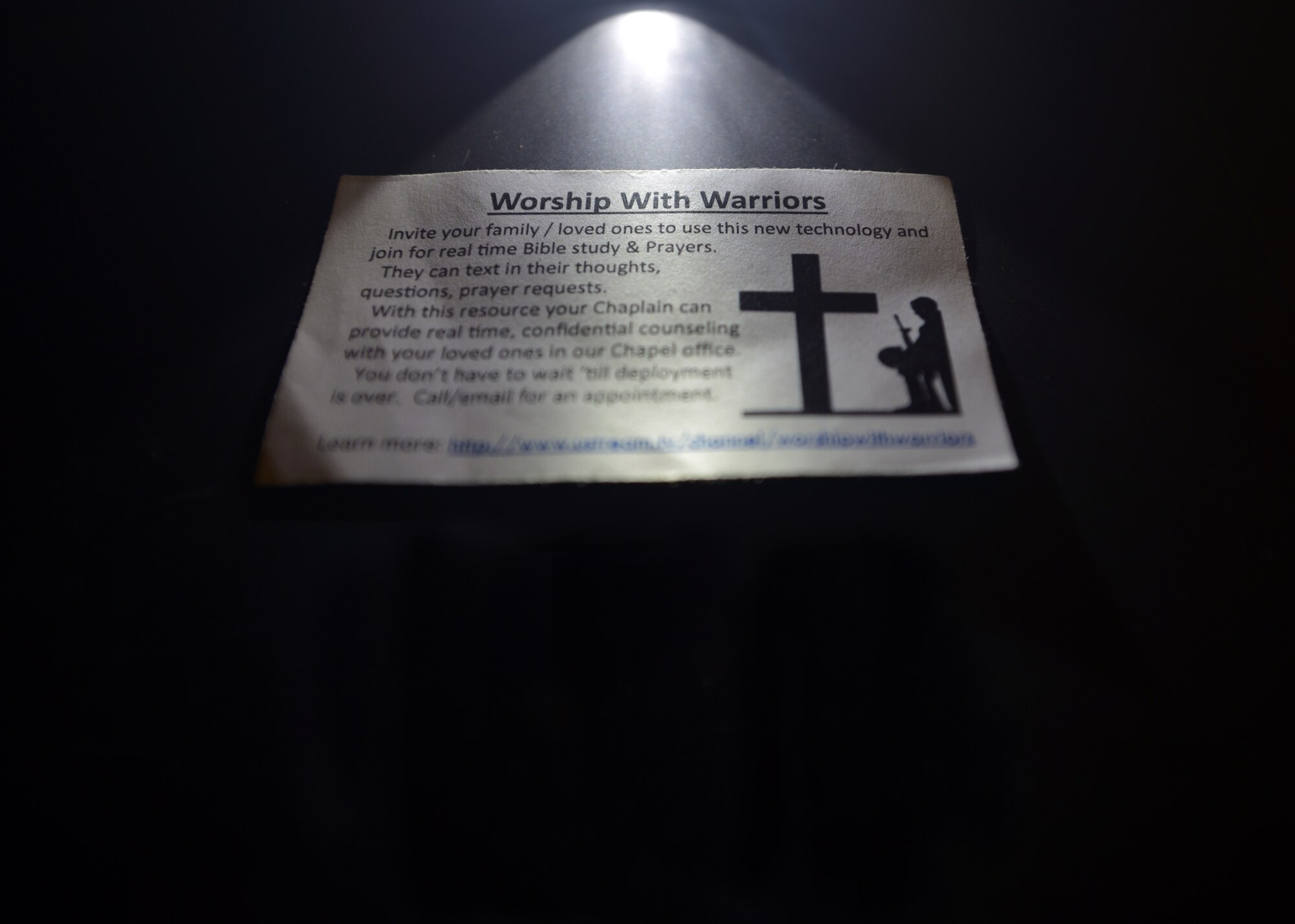 The business card of a 379th Air Expeditionary Wing Chapel Worship With Warriors, a program to build stronger relationships by combining social and spiritual fitness which provides real-time live counseling between Airmen deployed to Al Udeid Air Base, Qatar and their loved ones back home. 