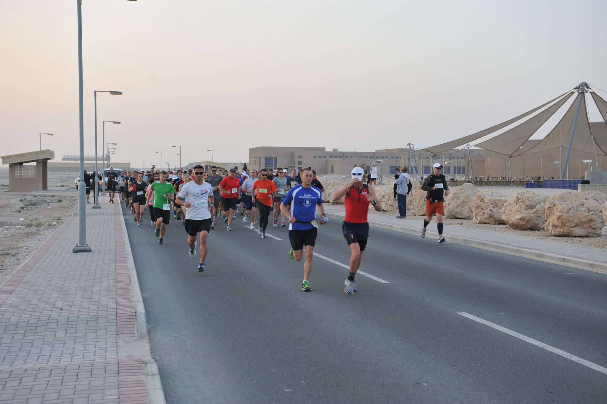 Service members begin the Melbourne Music Marathon half marathon, half relay and full marathon at Al Udeid Air Base, Qatar, Feb. 1, 2014. The two day event also included 5K and 8K runs and was attended by 206 runners with 158 finishers. The fastest time for the half marathon was 1:27:00 and the full marathon was 3:51:40. (U.S. Air Force photo by Master Sgt. David Miller)