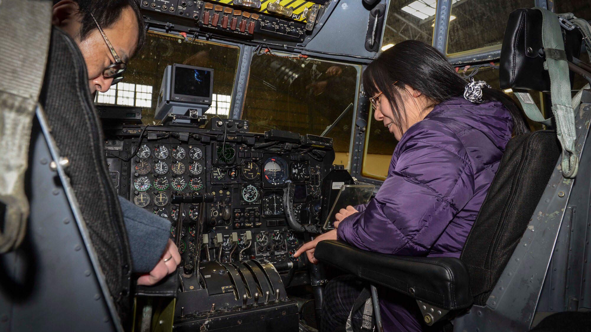 Members of the Japan Society for Security and Crisis Management tour the inside of a C-130 at Yokota Air Base, Japan, Feb. 4, 2014.  The Japan Society members had the opportunity to get a closer look at how Yokota responds to emergencies in the Pacific theater.  (U.S. Air Force photo by Airman 1st Class Soo C. Kim / released)