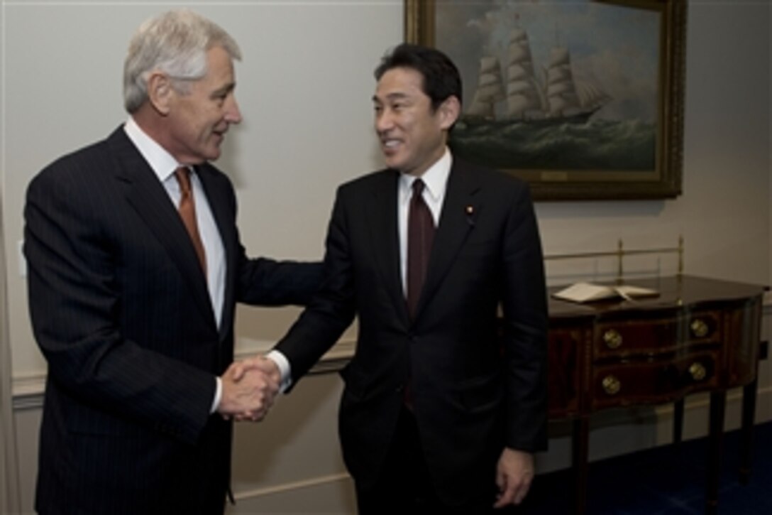 U.S. Defense Secretary Chuck Hagel greets Japanese Foreign Minister Fumio Kishida at the Pentagon, Feb. 7, 2014. Hagel and Kishida met to discuss issues of mutual importance. 