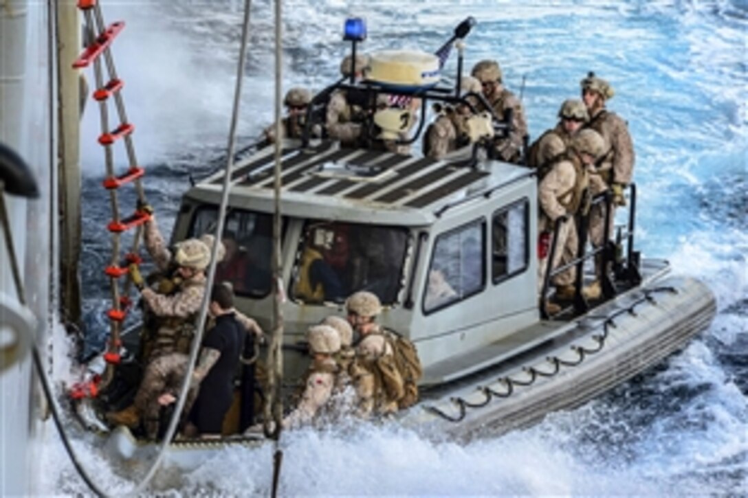 U.S. Marines board a rigid-hull inflatable boat from the amphibious assault ship USS Boxer in the Arabian Sea, Feb. 1, 2014. The Boxer is the flagship for the Boxer Amphibious Ready Group, and, with the embarked 13th Marine Expeditionary Unit, is deployed in support of maritime security operations and theater security cooperation efforts in the U.S. 5th Fleet area of responsibility.