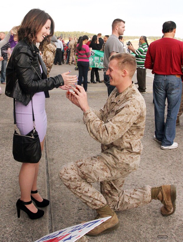 Lance Cpl. Cody Ryan drops to a knee and pulls out a ring to propose to his girlfriend, Mary Kate Sheehan, Feb. 2., at Marine Corps Air Station Cherry Point. Ryan had just arrived back at Cherry Point after a nearly seven-month deployment to Afghanistan with Marine Aerial Refueler Transport Squadron 252, and used the occasion to propose to the girl he has known since they were both 10 years old.


