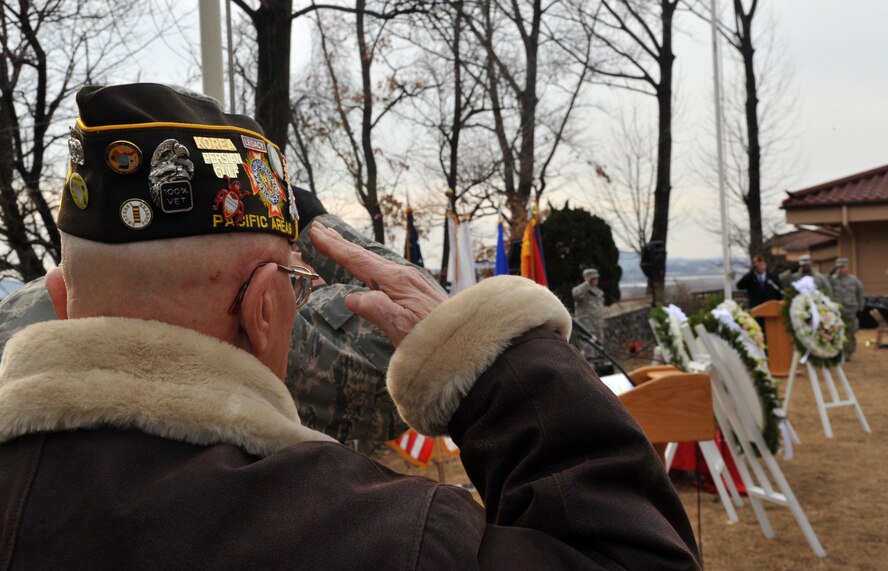 Earnest Lee, Korean War veteran and Hill 180 remembrance ceremony distinguished guest, renders a salute to honor the memory of those who fought in the Battle of Bayonet Hill at the conclusion of the event at Osan Air Base, Republic of Korea, Feb. 7, 2014. Lee, along with ROK air force Maj. Gen. Jae-Bock Park, ROK air force Col. Eun-Chul Kim and U.S. Army Col. Joseph Gleichenhaus, were all chosen to place wreaths at the site of the Hill 180 memorial during the ceremony. (U.S. Air Force photo/Airman 1st Class Ashley J. Thum)