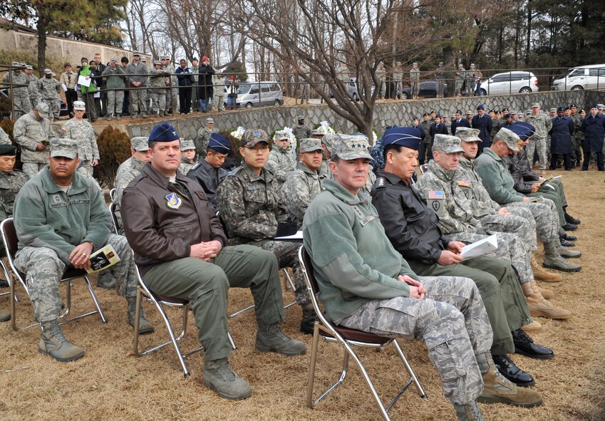 Service members from the U.S. and Republic of Korea militaries listen to the narrative of the Battle of Bayonet Hill being read during the Hill 180 remembrance ceremony at Osan Air Base, ROK, Feb. 7, 2014. Thirty out of the 47 enemy forces killed during the battle died as a result of bayonet wounds, which helped the engagement earn the nickname the “Battle of Bayonet Hill.” (U.S. Air Force photo/Airman 1st Class Ashley J. Thum)