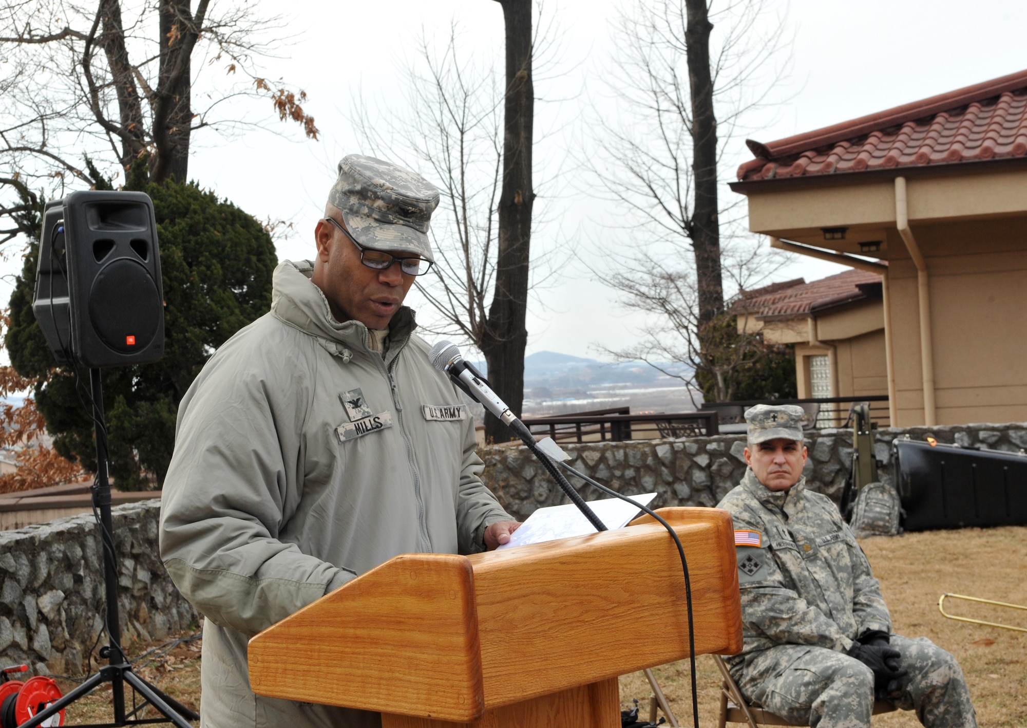 U.S. Army Col. Charles Mills, Combined Joint Fires Element deputy chief, reads the narrative of the Battle of Hill 180 during the remembrance ceremony at Osan Air Base, Republic of Korea, Feb. 7, 2014. ROK air force Maj. Gen. Jae-Bock Park, Combined Forces Command, also spoke at the ceremony and shared his respect for the bravery of the U.S. Army Soldiers who fought off Chinese forces to gain control of the hill. (U.S. Air Force photo/Airman 1st Class Ashley J. Thum)