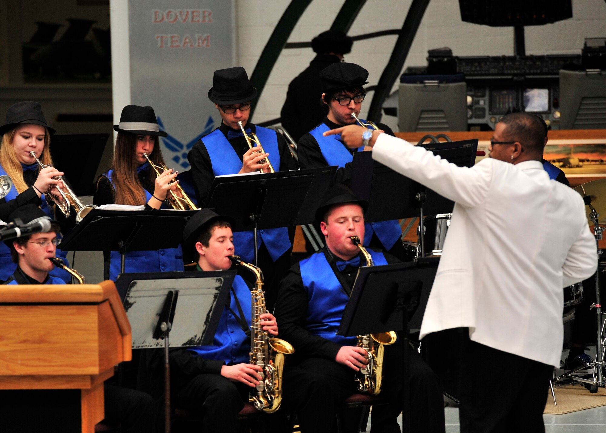 Members of the Dover High School Jazz Band under the direction of Mr. Lenny Knight, perform during the 2014 Honorary Commander Induction Ceremony, Feb. 8, 2014, at the Air Mobility Command Museum, Dover Air Force Base, Del. The honorary commanders program is a community outreach effort that builds upon the great relationships between local civic leaders and DAFB personnel. (U.S. Air Force photo/Staff Sgt. Elizabeth Morris)