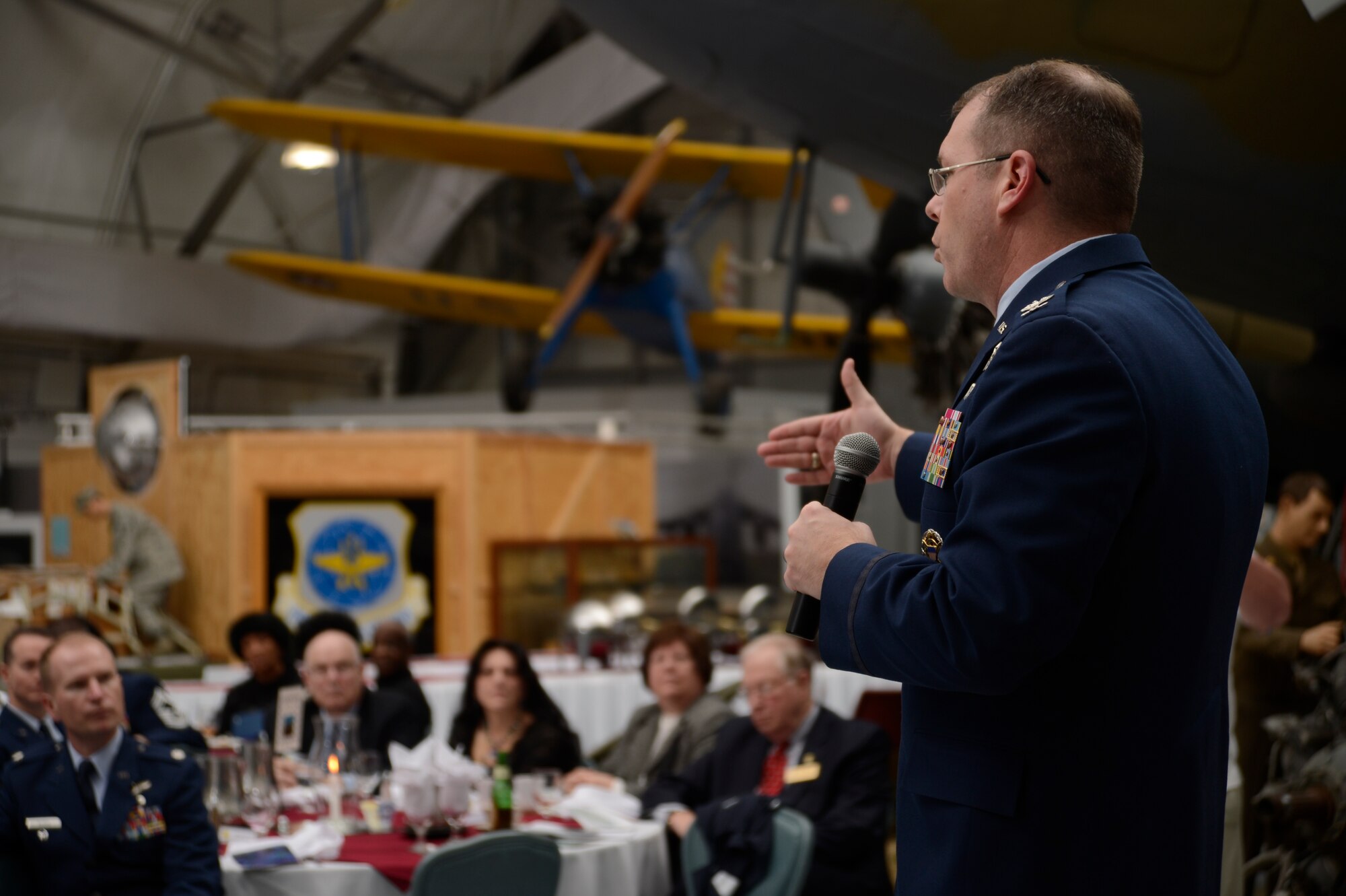 Col. Rick Moore, commander of the 436th Airlift Wing, speaks during the 2014 Honorary Commander Induction Ceremony, Feb. 8, 2014, at the Air Mobility Command Museum, Dover Air Force Base, Del. The honorary commander program matches civic leaders with active-duty and reserve military commanders to help community members understand the importance of Dover AFB's mission while allowing military commanders and units to learn more about the community in which they live. (U.S. Air Force photo/Staff Sgt. Elizabeth Morris)