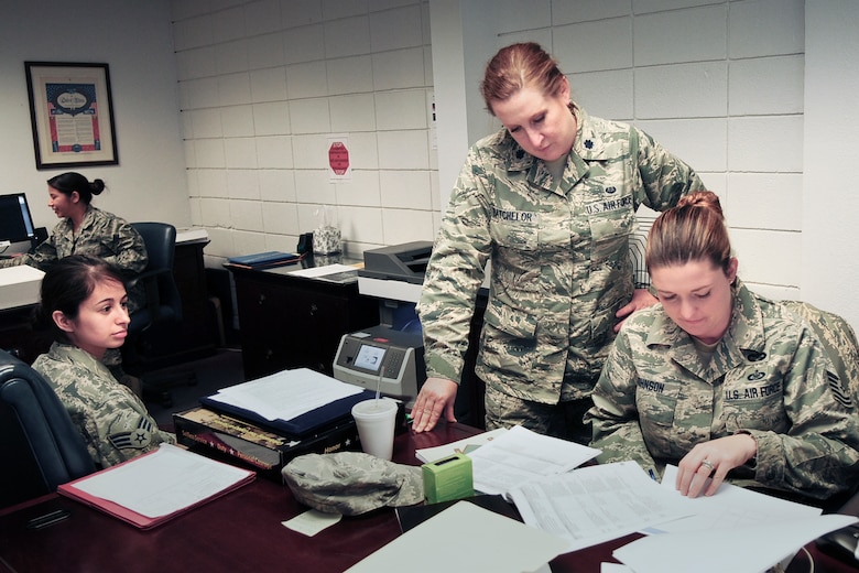 Lt. Col. Sonya Batchelor (second from right), staff judge advocate with the 149th Fighter Wing, Texas Air National Guard, works with Tech. Sgt. Freya Johnson, a paralegal with the wing, during their unit training assembly, at Joint Base San Antonio-Lackland, Texas, Feb. 8, 2014. (Air National Guard photo by Tech. Sgt. Eric Wilson / Released)