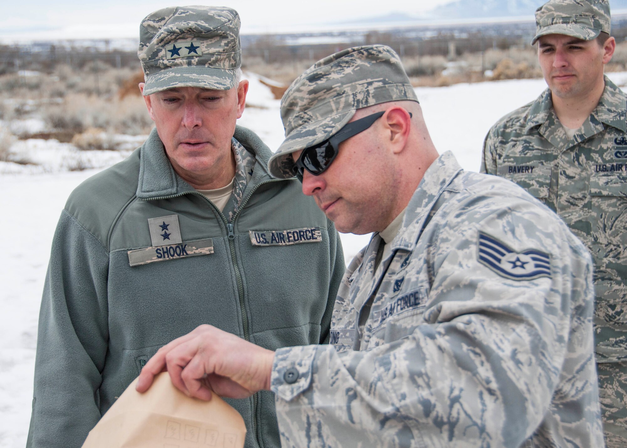 Staff Sgt. Matthew Long, 419th Explosive Ordnance Disposal, explains to Maj. Gen. Richard Shook, mobilization assistant to the Chief of the Air Force Reserve, how EOD takes care of a suspicious package. Long told the general what to look for when receiving a package, then explained how opening the package could trigger an explosion. (U.S. Air Force photo/Senior Airman Crystal Charriere)