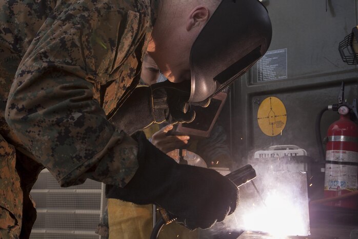 Brig. Gen. Niel E. Nelson uses a cutting torch during his visit Jan. 29 to the Kin Blue Training Area during Maintenance Training Exercise 14-1. The event gave Marines with 3rd Maintenance Battalion a chance to hone their skills prior to conducting missions the battalion will support in the coming months. Nelson is the commanding general of 3rd Marine Logistics Group, III Marine Expeditionary Force.
