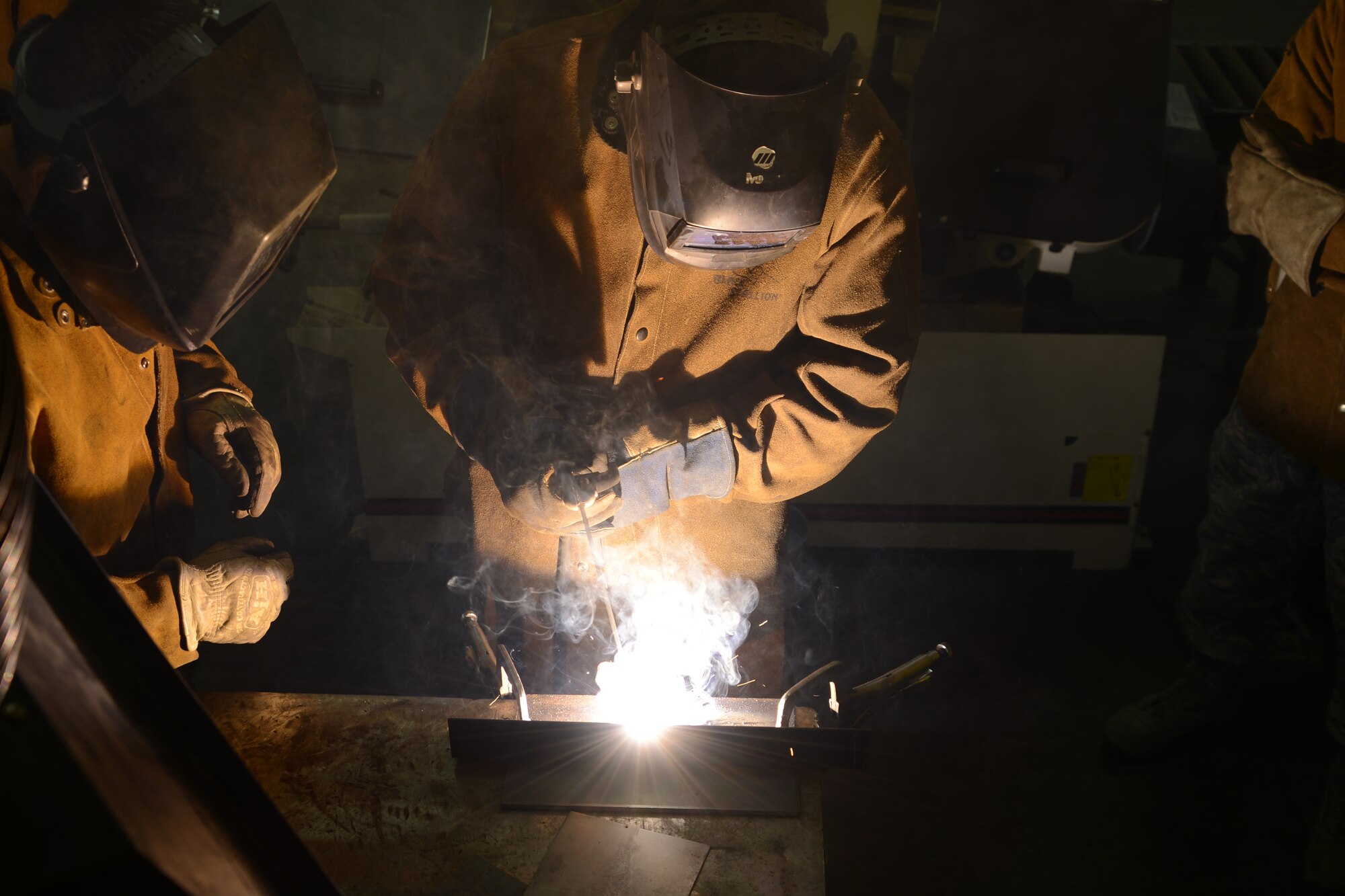 Col. Tyler Otten, 477th Fighter Group commander, is instructed on shielded metal arc welding procedures by members of the 477th Civil Engineer Structural shop during the 477th Fighter Group Reserve Unit Training Assembly Feb. 9. The UTA provides an opportunity for all the Reservists assigned to the 477th Fighter Group to come together and train one weekend a month. (U.S. Air Force/Tech. Sgt. Dana Rosso)