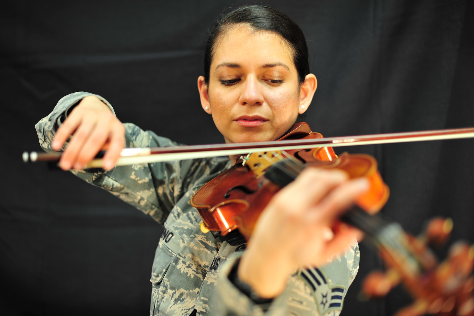 Senior Airman Kelly Andino, 403rd Operations Group intelligence analyst, fulfilled one of her dreams by joining the Air Force Reserve. The Honduran native journeyed to the United States on a music scholarship and recently achieved two of her goals: joining the military and becoming a U.S. citizen. (U.S. Air Force photo/Tech. Sgt. Ryan Labadens)