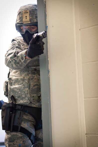 Members of the 934th Security Forces Squadron conduct an active shooter exercise during the Feburary Unit Training Assembly at the old Navy building, Minneapolis-St. Paul Air Reserve Station, Minn. (U.S. Air Force photo by Staff Sgt. Carla Fernandez/Released)
