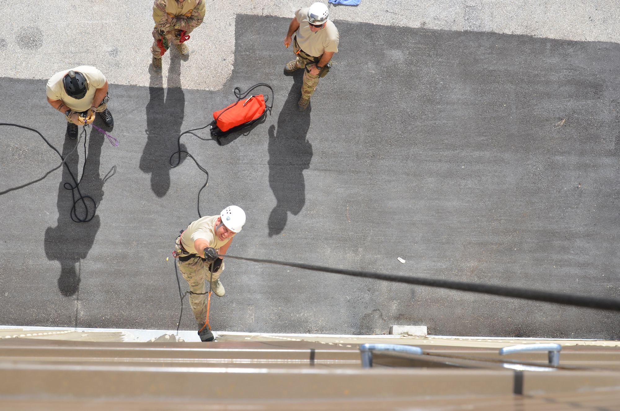 Reserve Pararescueman from the 920th Rescue Wing, Patrick Air Force Base, Fla., rappel down the side of the brand-new Guardian Angel Training Tower here. The tower is specifically designed to prepare them for the battlefield by simulating a variety of rescue environments. (U.S. Air Force photo/2nd Lt. Leslie Forshaw)