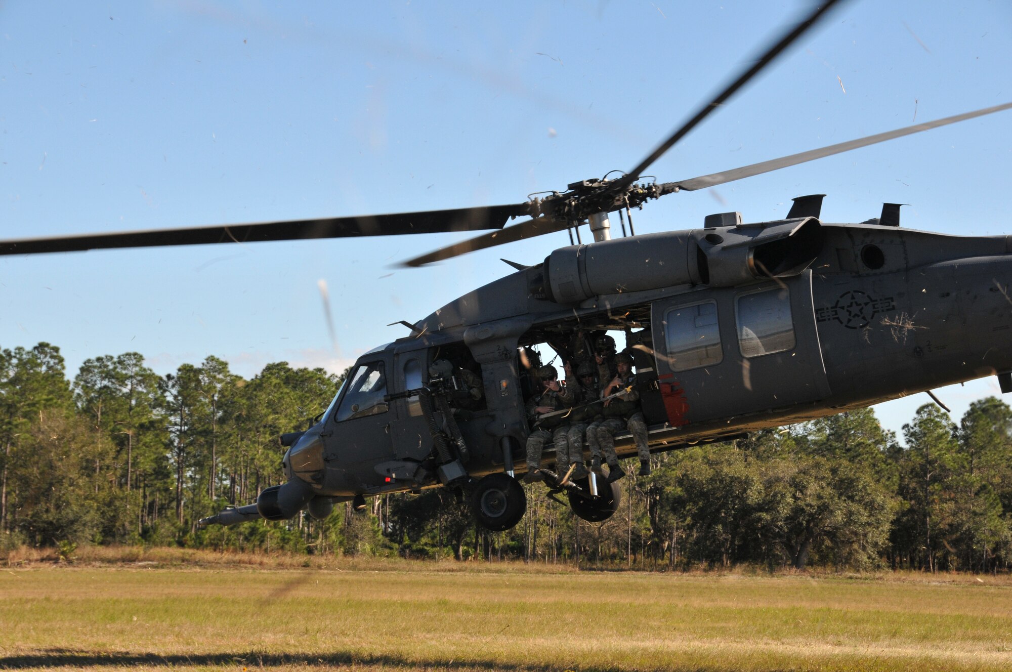 Members from the 147th Reconnaissance Wing Air Support Operations Squadron lift off in a HH-60 Pave Hawk at Avon Park Air Force Range, Florida December 16, 2013. Performing exercises at the Florida range allows the airmen to hone the necessary skill sets to perform their jobs and missions in an environment that allows for the use of live fighter aircraft and live munitions to replicate real-life warfighting scenarios. National Guard
photo by 2nd Lt. Alicia Lacy.