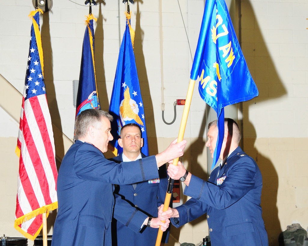 Colonel Donald V. McGuire receives the Mission Support guidon from Colonel John J. Higgins, 107th Wing Commander, to assume command of the Mission Support Group at a ceremony held at the Niagara Falls Air Reserve Station on Feb. 8, 2014. (U.S. Air National Guard photo/ Senior Master Sgt. Ray Lloyd)