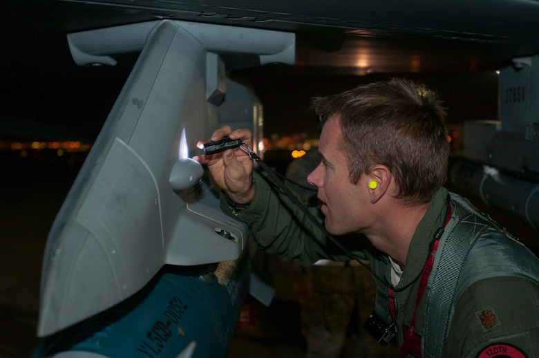 U.S. Air Force Maj. Josh Anderson, 120th Fighter Squadron, Colorado Air National Guard, conducts pre-checks on an F-16 Fighting Falcon fighter jet from the 120th Fighter Squadron at Buckley Air Force Base, Colo., before a night training mission at Red Flag 14-1, at Nellis Air Force Base, Nev., Feb. 04, 2014. Combat units come together from the United States and its allied countries to engage in realistic combat training scenarios within Nellis’ 2.9 million acre Test and Training Range Complex. (U.S. Air National Guard photo/Tech. Sgt. Wolfram M. Stumpf)