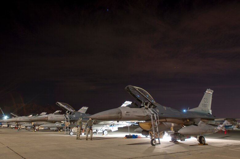 U.S. Air Force F-16 Fighting Falcons from the 120th Fighter Squadron, Buckley Air Force Base, Colorado Air National Guard, are prepped before a night mission during Red Flag 14-1, at Nellis Air Force Base, Nev., Feb 04, 2014. Combat units come together from the United States and its allied countries to engage in realistic combat training scenarios within Nellis’ 2.9 million acre Test and Training Range Complex. (U.S. Air National Guard photo/Tech. Sgt. Wolfram M. Stumpf)