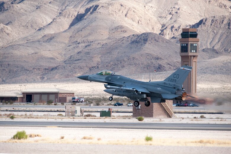 An F-16 Fighting Falcon fighter jet takes off for a training mission during Red Flag 14-1, at Nellis Air Force Base, Nev., Feb 03, 2014. Combat units come together from the United States and its allied countries to engage in realistic combat training scenarios within Nellis’ 2.9 million acre Test and Training Range Complex. The F-16 is assigned to the 120th Fighter Squadron at Buckley Air Force Base, Colorado Air National Guard.  (U.S. Air National Guard photo by Tech. Sgt. Wolfram M. Stumpf)