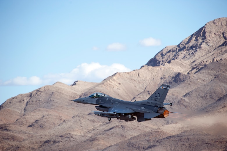 An F-16 Fighting Falcon fighter jet takes off for a training mission during Red Flag 14-1, at Nellis Air Force Base, Nev., Feb 03, 2014. Combat units come together from the United States and its allied countries to engage in realistic combat training scenarios within Nellis’ 2.9 million acre Test and Training Range Complex. The F-16 is assigned to the 120th Fighter Squadron at Buckley Air Force Base, Colorado Air National Guard.  (U.S. Air National Guard photo by Tech. Sgt. Wolfram M. Stumpf)