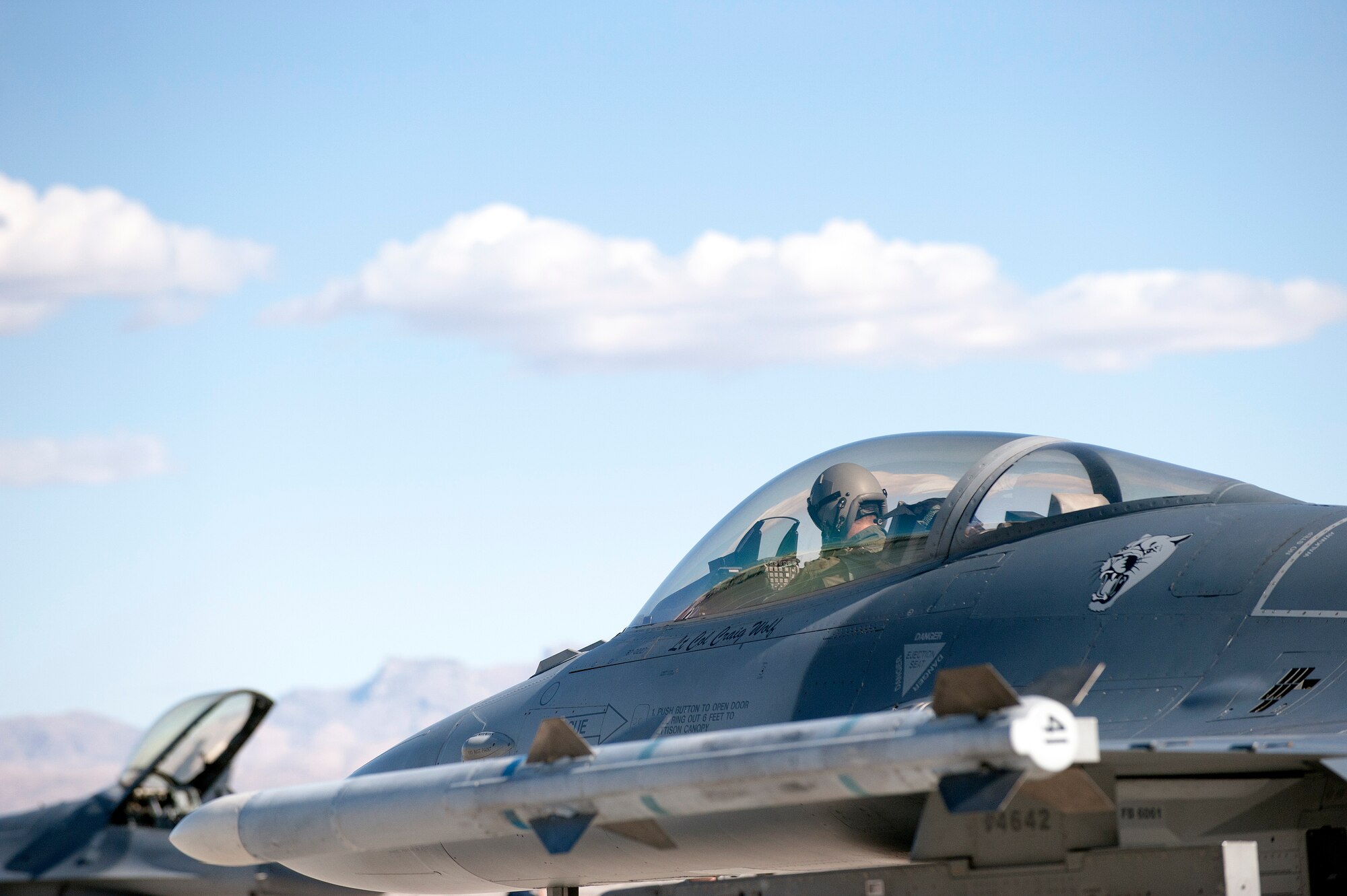 A U.S. Air Force pilot from the 120th Fighter Squadron, Colorado Air National Guard waits to taxi in an F-16 Fighting Falcon before departing on a training mission during Red Flag 14-1, at Nellis Air Force Base, Nev., Feb. 03, 2014. Combat units come together from the United States and its allied countries to engage in realistic combat training scenarios within Nellis’ 2.9 million acre Test and Training Range Complex. (U.S. Air National Guard photo/Tech. Sgt. Wolfram M. Stumpf)
