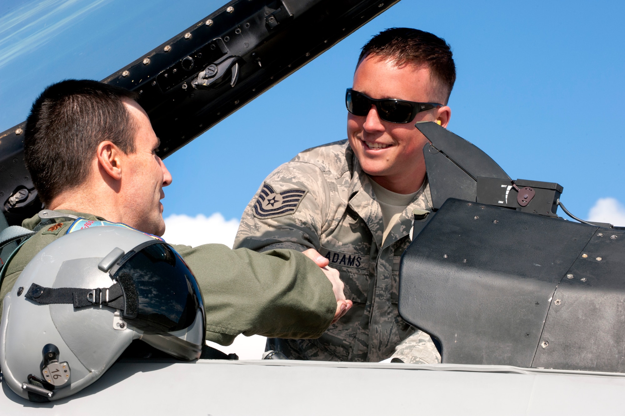 U.S. Air Force Maj. Michael Gommel (left), 120th Fighter Squadron, shakes hands with Tech. Sgt. Jacob Adams, 140th Maintenance Squadron, Buckley Air Force Base, Colorado Air National Guard, before starting pre-flight checks on an F-16 Fighting Falcon during Red Flag 14-1, at Nellis Air Force Base, Nev., Jan. 31, 2014. Combat units come together from the United States and its allied countries to engage in realistic combat training scenarios within Nellis’ 2.9 million acre Test and Training Range Complex. (U.S. Air National Guard photo/Tech. Sgt. Wolfram M. Stumpf/Released)