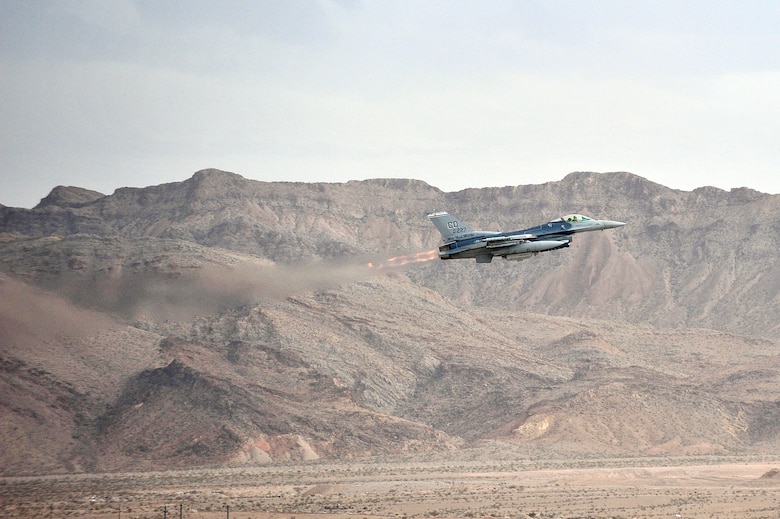 An F-16 Fighting Falcon fighter jet takes off for a training mission during Red Flag 14-1, at Nellis Air Force Base, Nev., Jan. 30, 2014. Combat units come together from the United States and its allied countries to engage in realistic combat training scenarios within Nellis’ 2.9 million acre Test and Training Range Complex. The F-16 is assigned to the 120th Fighter Squadron at Buckley Air Force Base, Colorado Air National Guard.  (U.S. Air National Guard photo by Tech. Sgt. Wolfram M. Stumpf)