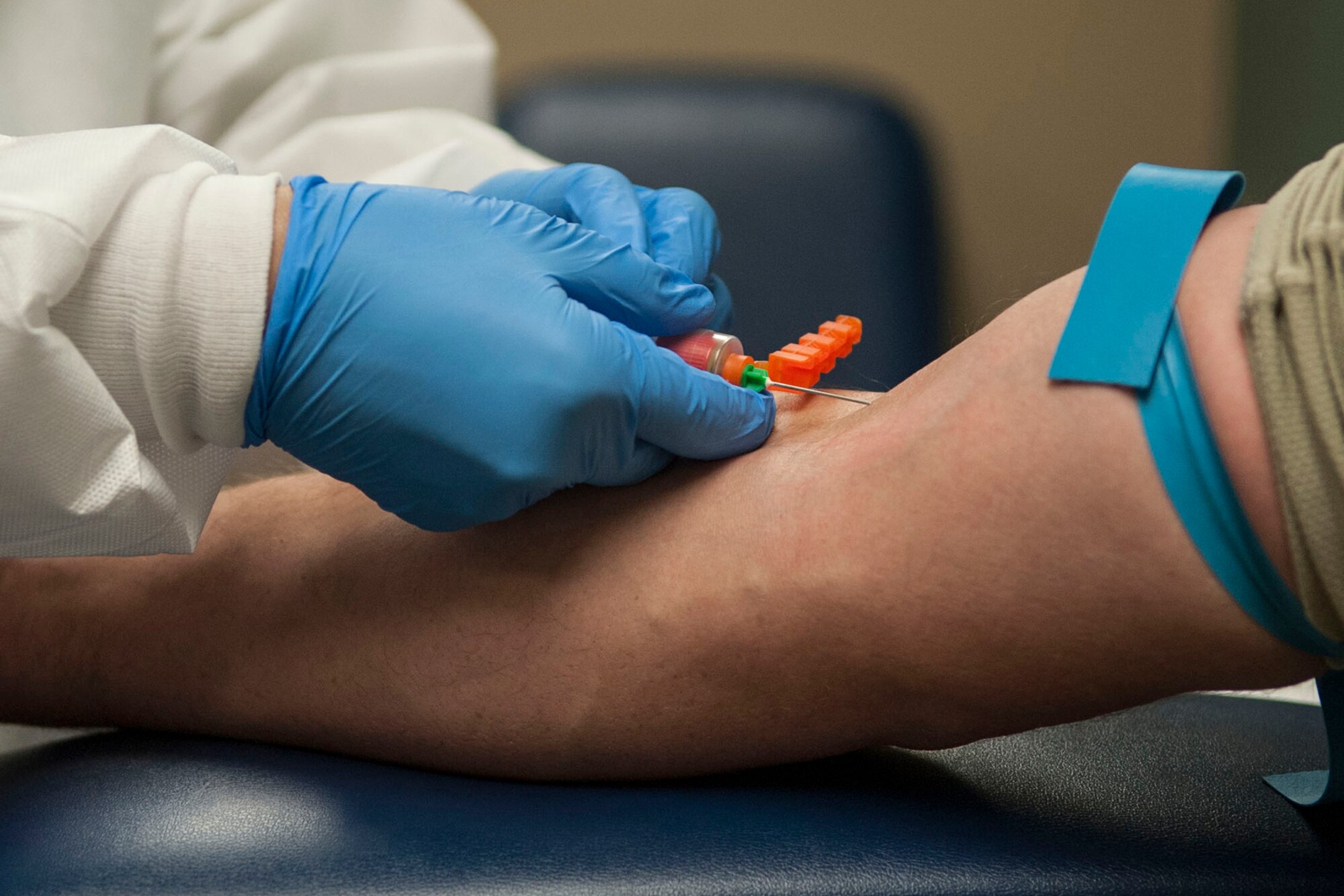 A U.S. Air Force lab technician assigned to the 307th Medical Squadron, draws blood from a patient during the February Unit Training Assembly weekend at Barksdale Air Force Base, La., Feb. 8, 2014. (U.S. Air Force photo by Master Sgt. Jeff Walston/Released) 