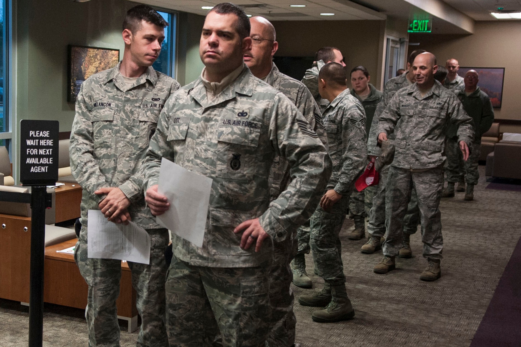 Members of the 307th Bomb Wing wait in line for their medical records at Barksdale Air Force Base, La., Feb. 8, 2014. More than a hundred Reservists have their records updated to maintain deployment readiness status during each Unit Training Assembly (UTA) weekend by the 307th Medical Squadron. (U.S. Air Force photo by Master Sgt. Jeff Walston/Released) 