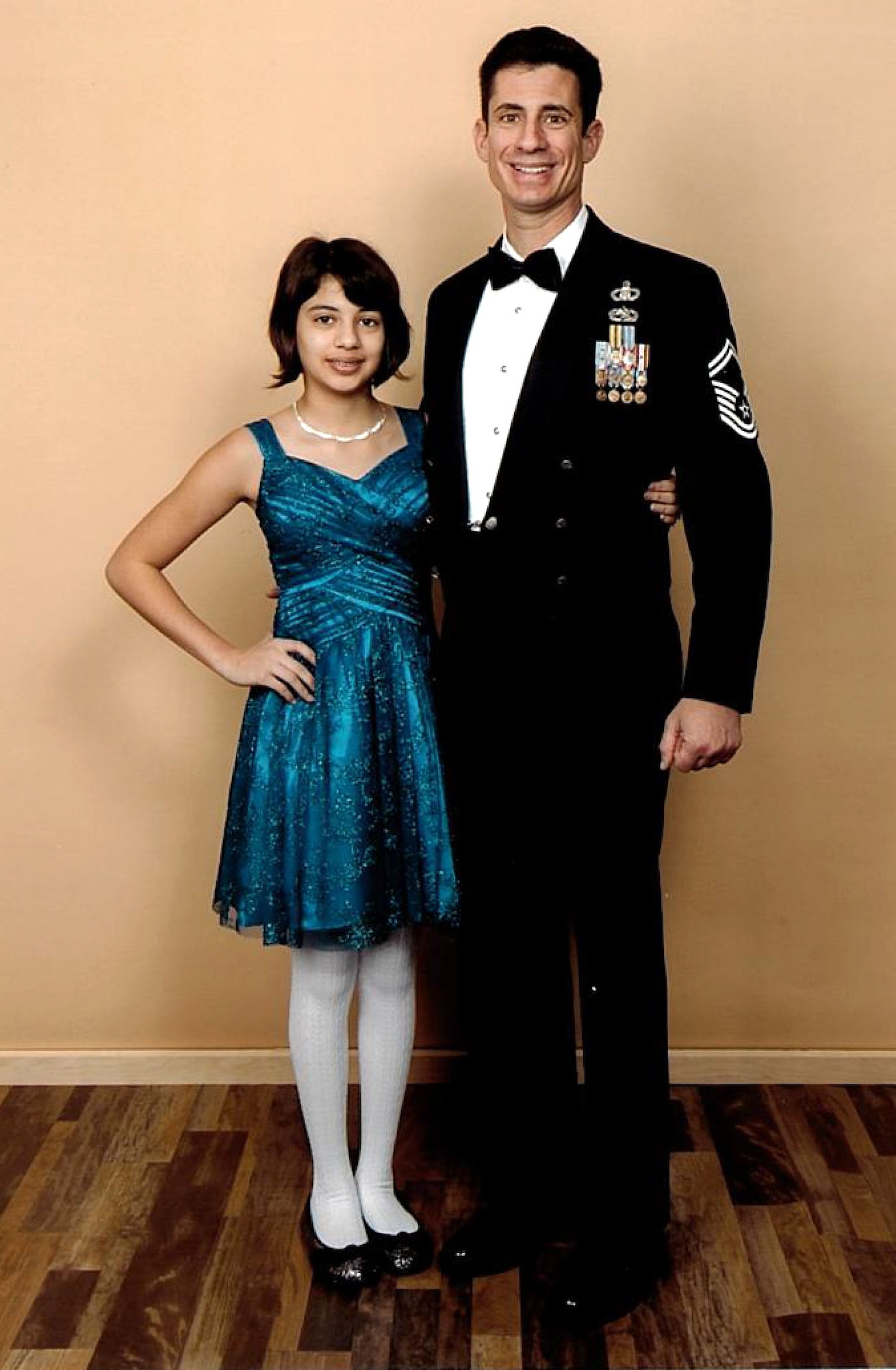 Senior Master Sgt. Thomas Ragonese, 512th Airlift Control Flight superintendent, poses for a picture with his daughter, Melissa, at the Holy Cross Father & Daughter Winter Wonderland Dance Feb. 1, 2014, Dover, Del. In addition to his role in the reserve, Ragonese also works as a Wilmington, Del. police officer. (submitted photo)