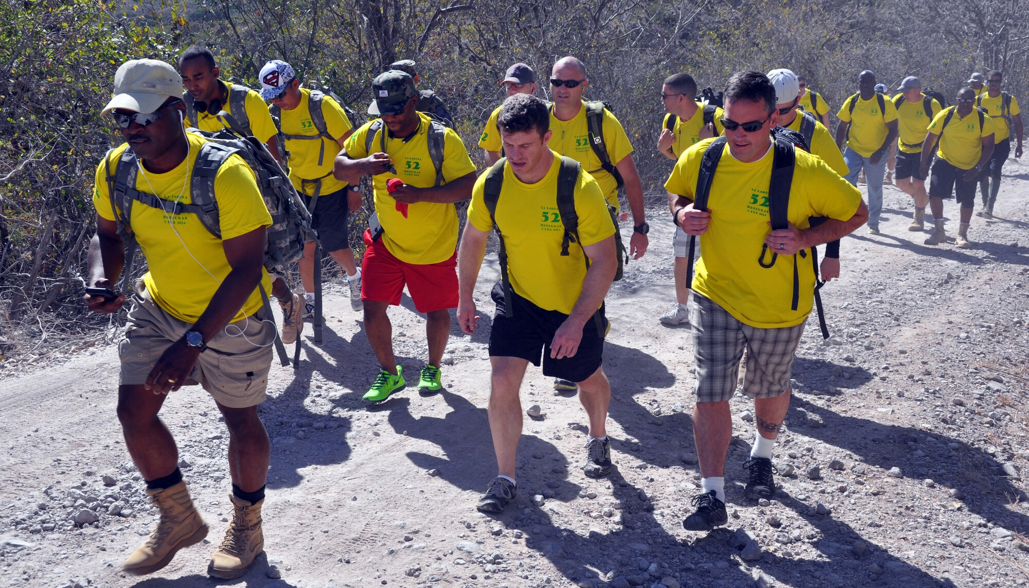 Joint Task Force-Bravo members make the trek up a mountain during the 52nd Joint Task Force-Bravo "Chapel Hike" in Honduras, Feb. 8, 2014.  More than 120 members of Joint Task Force-Bravo spent the day delivering more than 2,400 pounds of food and medical supplies to families in need in the mountain village of La Laguna, Honduras.  To deliver the supplies, Task Force members carried the items on a more than seven-mile round trip hike, with an elevation gain of 1,700 feet.  All of the food and supplies were purchased with funds donated by Task Force members.  (U.S. Air Force photo by Capt. Zach Anderson)  