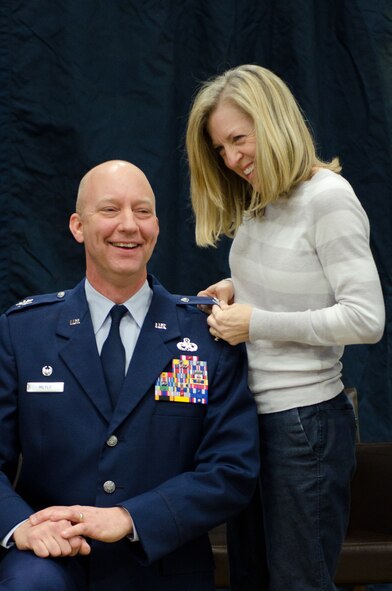 Lt. Col. Gordon Meyer, 139th Airlift Wing Mission Support Group Commander, Missouri Air National Guard, has the rank of Colonel pinned on by family members during a promotion ceremony at Rosecrans Air National Guard Base, Mo., on February 8, 2014. (U.S. Air National Guard photo by Senior Airman Sheldon Thompson/Released)