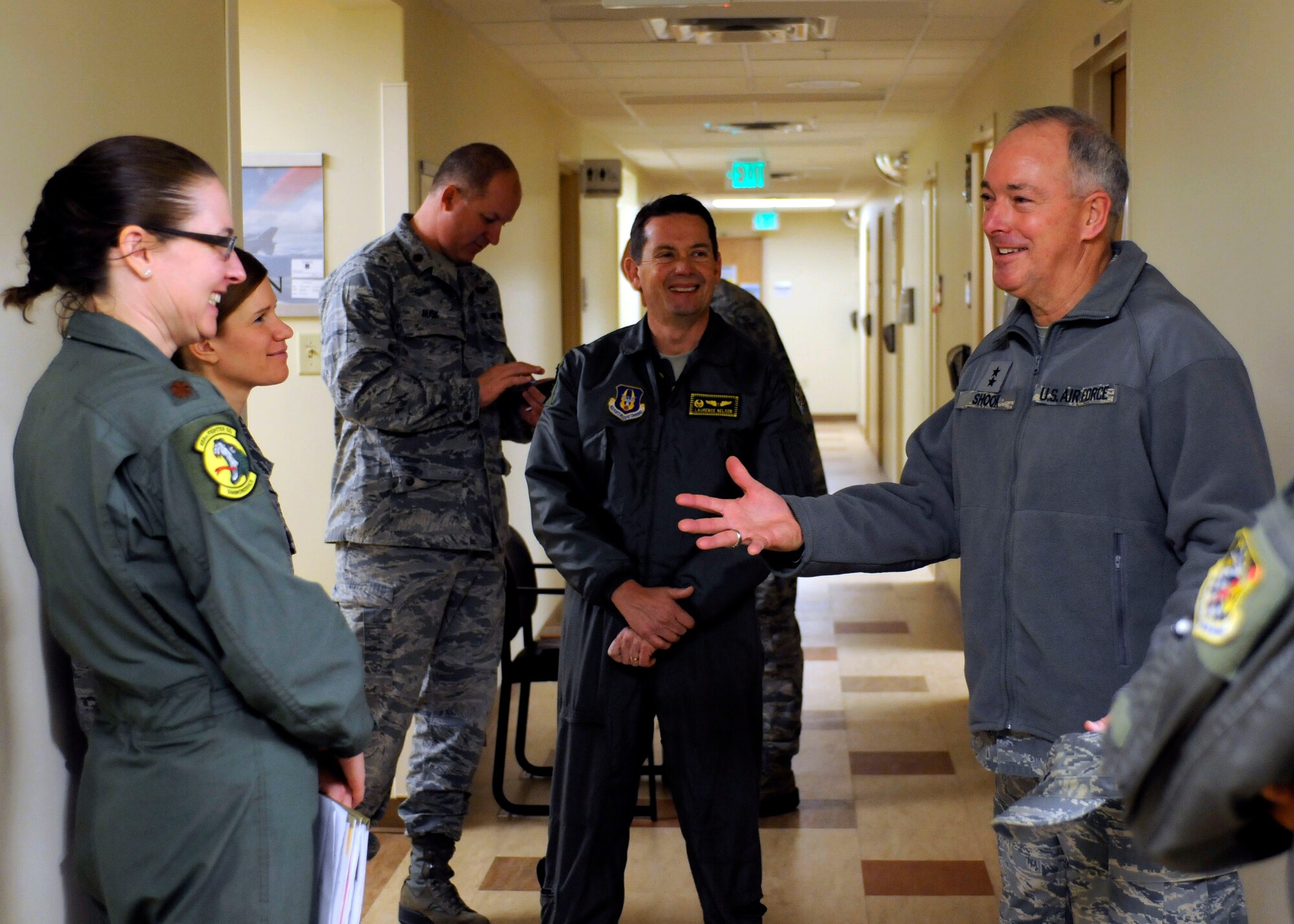 Maj. Sara Whittingham, a residency trained flight surgeon with the 419th Medical Squadron, and Col. Laurence Nelson, commander, 419th Medical Squadron speak with Maj. Gen. Richard Shook, mobilization assistant to the Chief of the Air Force Reserve as part og the 419th Fighter Wing tour here today. (U.S. Air Force photo/Senior Airman Allen Stokes)