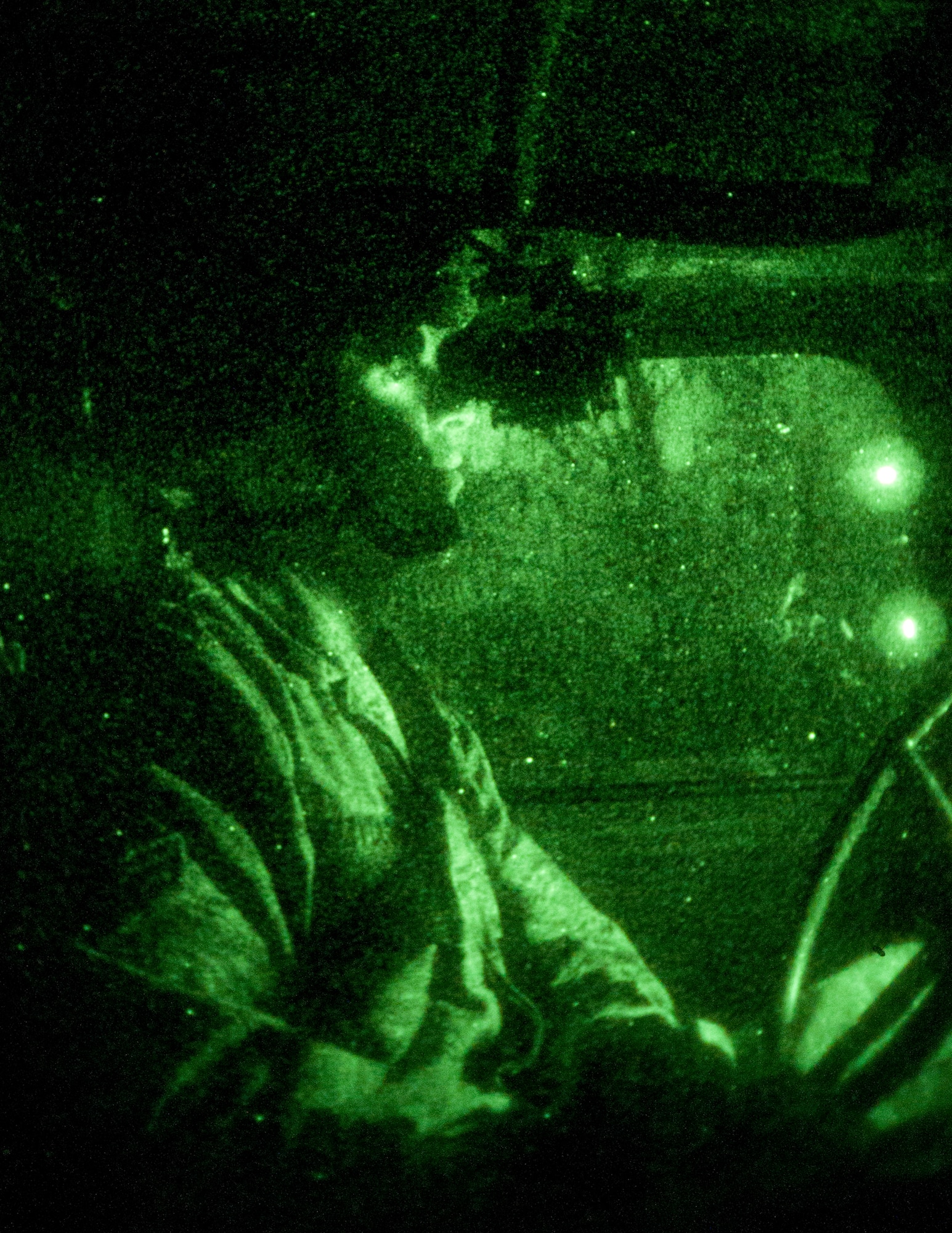 The 108th Contingency Response Group conducts training Jan. 11, 2014 with new members of the CRG at Joint Base McGuire-Dix-Lakehurst, N.J. The CRG members drove in High Mobility Multipurpose Wheeled Vehicles with night vision goggles during the evening hours at DTA3 on the Fort Dix side of the base. (U.S. Air National Guard photo by Senior Airman Kellyann Novak / Released)