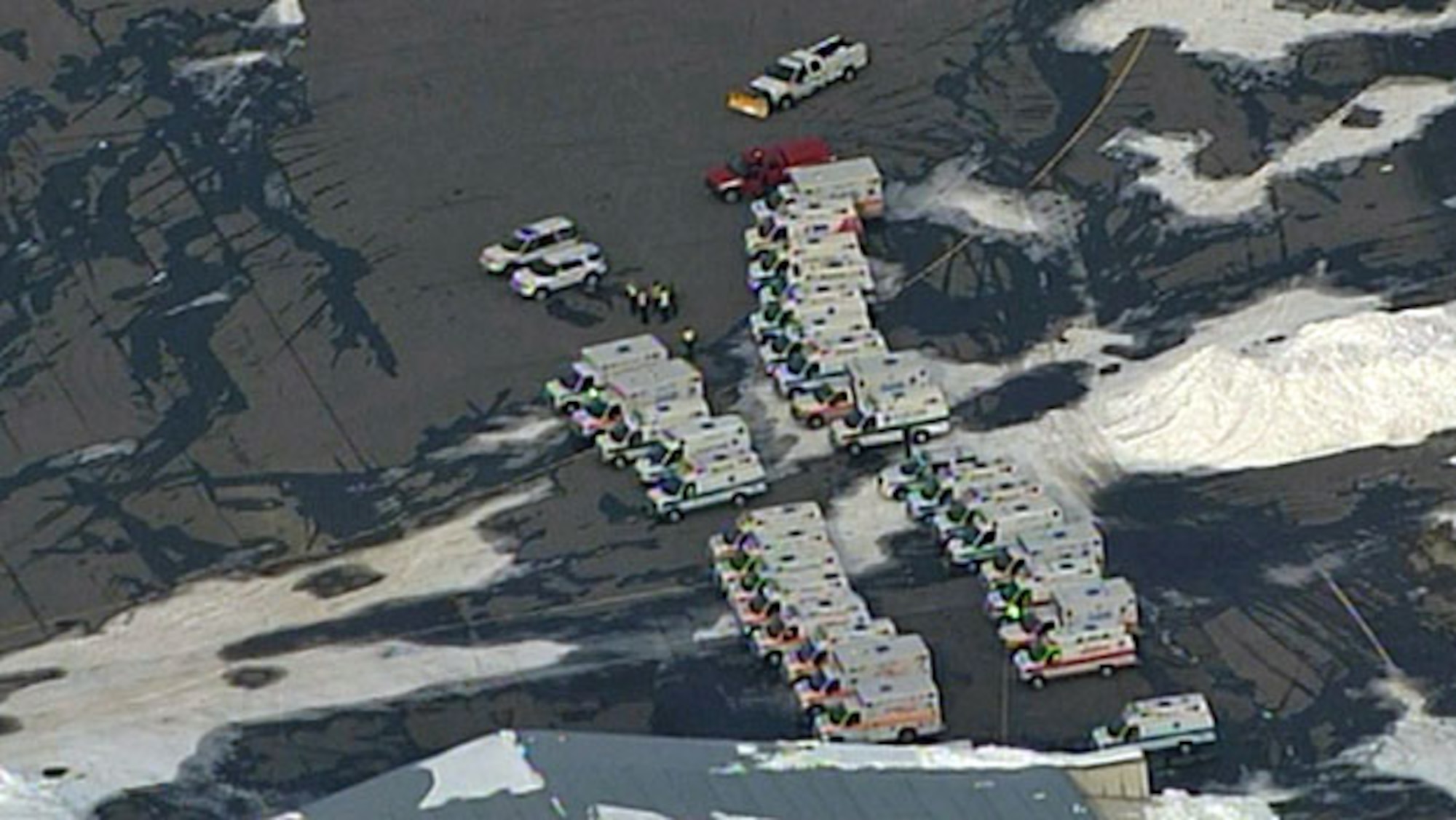 HANSCOM AIR FORCE BASE, Mass. – Emergency responders prepare for the possible arrival of an Air Force C-5B, which had lost pressurization over the Atlantic Ocean at approximately 11 a.m. Feb. 8. Alerted that the aircraft might be diverted to the base, Hanscom officials quickly mobilized a full emergency response effort. The plane was ultimately routed to Westover Air Reserve Base in Chicopee, Mass., where it landed without incident shortly after 2 p.m. The flight originated at Ramstein Air Base, Germany, and had been headed for Dover AFB, Del.  (Photo courtesy of WBZ-TV)