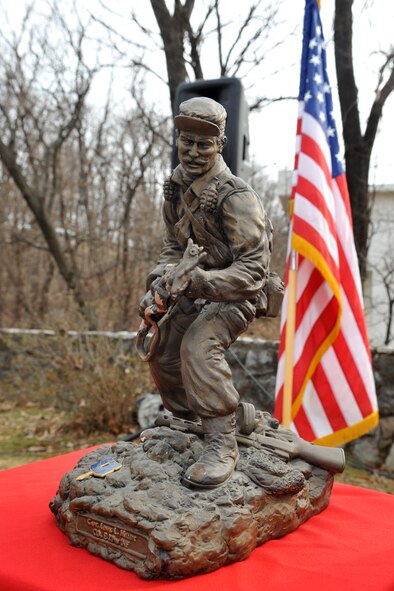 The figure of U.S. Army Capt. Lewis Millett, 27th Infantry Easy Company commander, is displayed during the Hill 180 remembrance ceremony at Osan Air Base, Republic of Korea, Feb. 7, 2014. Millett led the Battle of Bayonet Hill and was later awarded the Medal of Honor, July 5, 1951. (U.S. Air Force photo/Airman 1st Class Ashley J. Thum)