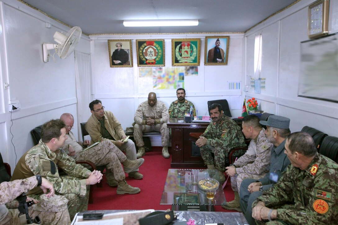Leaders from coalition forces, Afghan National Army 2nd and 3rd Brigades, 215th Corps, and Afghan Uniform Police meet to discuss operation Oqab 144, a mission in the Sangin Valley, Helmand province, Afghanistan, Jan. 28, 2014. The mission was an ANSF effort to clear the Sangin Valley of hostile threats to the local populace prior to the April 5 national elections.