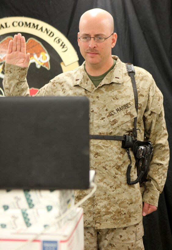 Chief Warrant Officer 4 Wayne D. Duree Sr., engineer equipment officer, Regional Command (Southwest), administers the Oath of Enlistment to his son and namesake, Wayne D. Duree Jr., via webcam from Camp Leatherneck, Helmand province, Afghanistan, early morning, Feb. 6, 2014. Stationed at Camp Pendleton, Calif., Duree Sr. deployed with Marine Expeditionary Brigade-Afghanistan during January 2014.
Duree Jr., a senior at Paloma Valley High School in Menifee, Calif., is scheduled to attend Marine Corps Recruit Training during November 2014 and become an intelligence specialist in the United States Marine Corps Reserve.