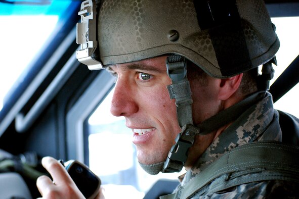 First Lt. Michael Olson coordinates the convoy's movements during a missile maintenance convoy mission Feb. 7, 2014 at Malmstrom Air Force Base, Mont. Allen is the 741st Missile Security Forces Squadron convoy commander (U.S. Air Force photo/Tech. Sgt. Steve Grever) 