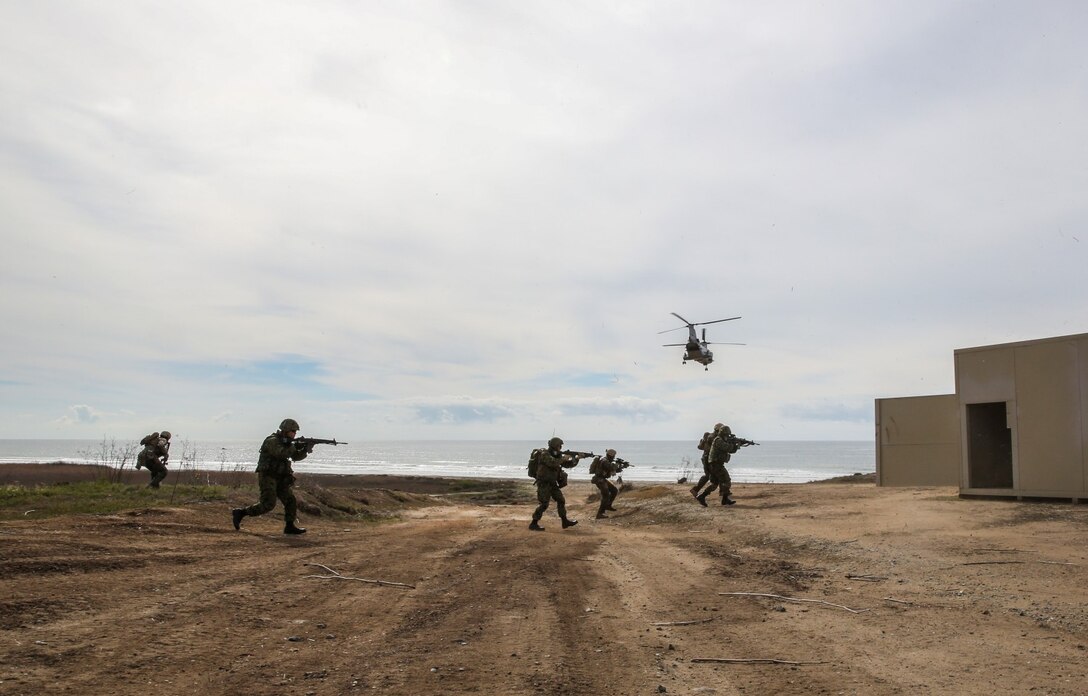 U.S. Marines with 1st Reconnaissance Battalion, 1st Marine Division, and soldiers from the Japan Ground Self-Defense Force begin their assault while conducting raid training during Exercise Iron Fist 2014 aboard Camp Pendleton, Calif., Feb. 7, 2014. Iron Fist is an amphibious exercise that brings together Marines and sailors from the 15th Marine Expeditionary Unit, other I Marine Expeditionary Force units, and soldiers from the JGSDF, to promote military interoperability and hone individual and small-unit skills through challenging, complex and realistic training. 