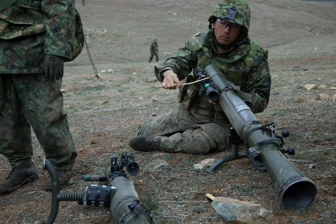A soldier from the Japan Ground Self-Defense Force cleans an 84mm Carl Gustav recoilless rifle while training with U.S. Marines with 1st Battalion, 1st Marine Regiment, during Exercise Iron Fist 2014 aboard Camp Pendleton, Calif., Feb. 7, 2014. Iron Fist 2014 is an amphibious exercise that brings together Marines and sailors from the 15th Marine Expeditionary Unit, other I Marine Expeditionary Force units, and soldiers from the JGSDF, to promote military interoperability and hone individual and small-unit skills through challenging, complex and realistic training. (U.S. Marine Corps photo by Lance Cpl. Anna K. Albrecht/Released)