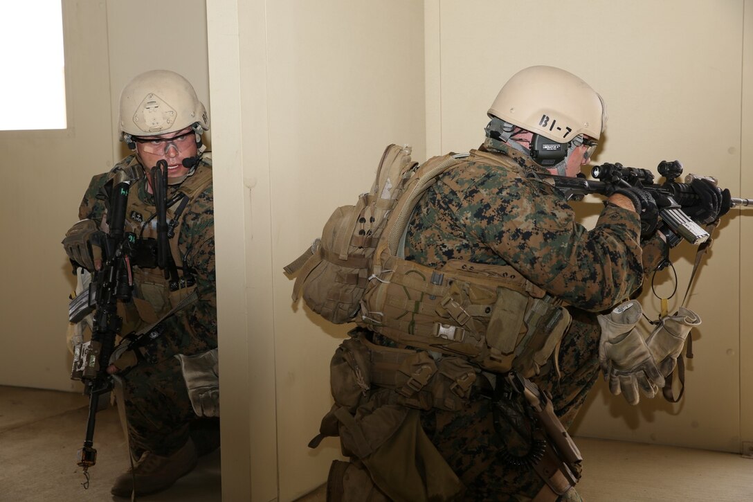U.S. Marines with 1st Reconnaissance Battalion, 1st Marine Division, prepare to exit a building and move toward their next objective while conducting raid training during Exercise Iron Fist 2014 aboard Camp Pendleton Calif., Feb. 7, 2014. Iron Fist is an amphibious exercise that brings together Marines and sailors from the 15th Marine Expeditionary Unit, other I Marine Expeditionary Force units and soldiers from the Japan Ground Self-Defense Force, to promote military interoperability and hone individual and small-unit skills through challenging, complex and realistic training. 