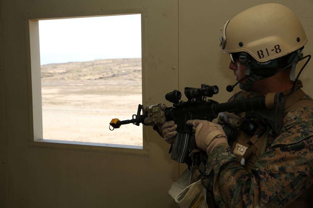 A U.S. Marine with 1st Reconnaissance Battalion, 1st Marine Division, posts security while conducting raid training during Exercise Iron Fist 2014 aboard Camp Pendleton Calif., Feb. 7, 2014. Iron Fist is an amphibious exercise that brings together Marines and sailors from the 15th Marine Expeditionary Unit, other I Marine Expeditionary Force units and soldiers from the Japan Ground Self-Defense Force, to promote military interoperability and hone individual and small-unit skills through challenging, complex and realistic training.