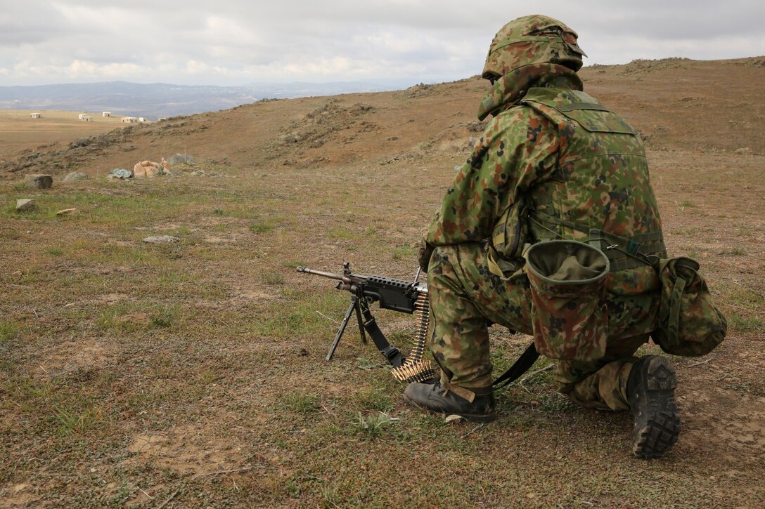 A soldier with the Japan Ground Self-Defense Force performs a combined company attack with U.S. Marines from 1st Battalion, 1st Marine Regiment, during Exercise Iron Fist 2014 aboard Camp Pendleton, Calif., Feb. 9, 2014. Iron Fist 2014 is an amphibious exercise that brings together Marines and sailors from the 15th Marine Expeditionary Unit, other I Marine Expeditionary Force units, and soldiers from the JGSDF, to promote military interoperability and hone individual and small-unit skills through challenging, complex and realistic training. (U.S. Marine Corps photo by Lance Cpl. Anna K. Albrecht/Released)