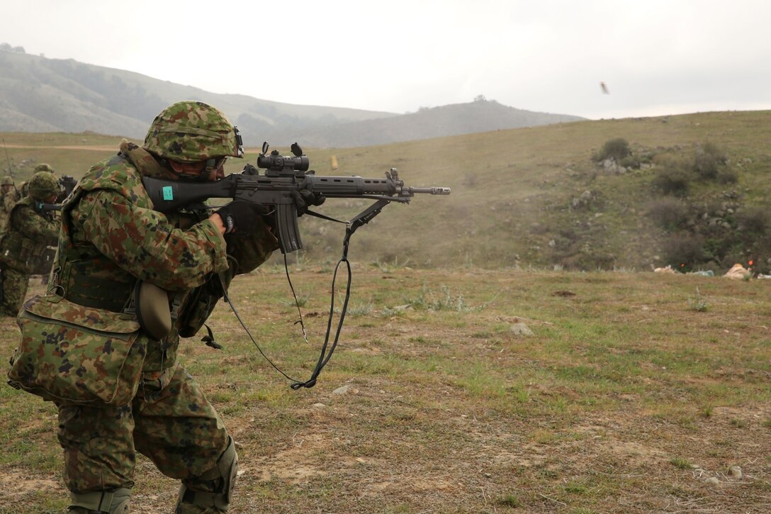 A soldier with the Japan Ground Self-Defense Force performs a combined company attack with U.S. Marines from 1st Battalion, 1st Marine Regiment, during Exercise Iron Fist 2014 aboard Camp Pendleton, Calif., Feb. 9, 2014. Iron Fist 2014 is an amphibious exercise that brings together Marines and sailors from the 15th Marine Expeditionary Unit, other I Marine Expeditionary Force units, and soldiers from the JGSDF, to promote military interoperability and hone individual and small-unit skills through challenging, complex and realistic training. (U.S. Marine Corps photo by Lance Cpl. Anna K. Albrecht/Released)