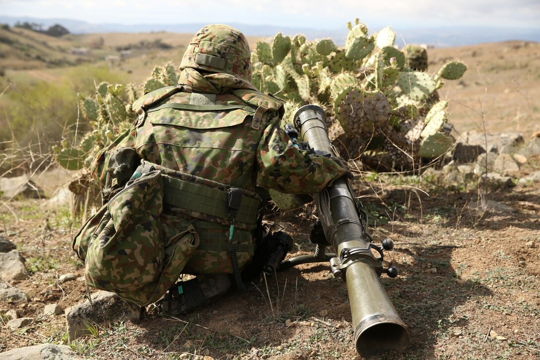 A soldier with the Japan Ground Self-Defense Force performs a combined company attack with U.S. Marines from 1st Battalion, 1st Marine Regiment, during Exercise Iron Fist 2014 aboard Camp Pendleton, Calif., Feb. 9, 2014. Iron Fist 2014 is an amphibious exercise that brings together Marines and sailors from the 15th Marine Expeditionary Unit, other I Marine Expeditionary Force units, and soldiers from the JGSDF, to promote military interoperability and hone individual and small-unit skills through challenging, complex and realistic training. (U.S. Marine Corps photo by Lance Cpl. Anna K. Albrecht/Released)