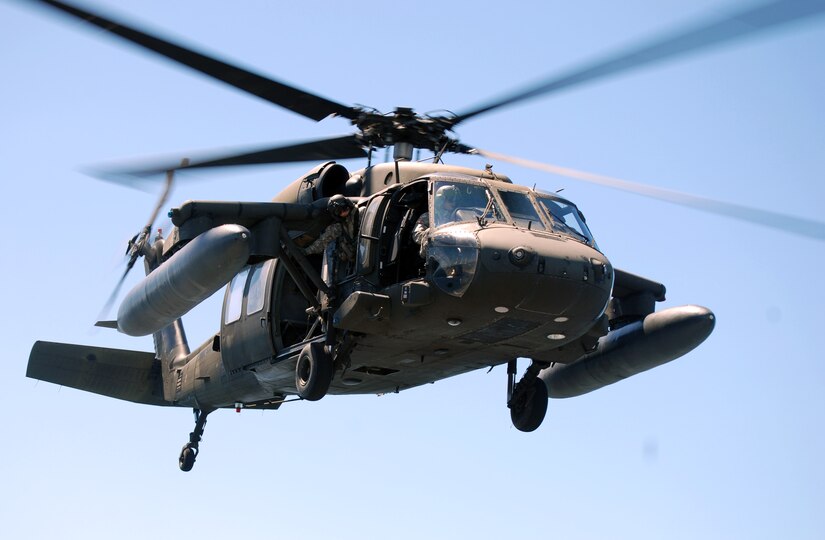 A UH-60 Blackhawk helicopter assigned to Joint Task Force Bravo's 1-228th Aviation Regiment makes an approach for a landing on the deck of the USS Rentz during deck landing qualification training off the coast of Honduras, Feb. 8, 2014. The training, which was conducted approximately 70 miles off the coast of Honduras, was done to qualify 1-228th pilots and crew chiefs on shipboard operations. (Courtesy photo)